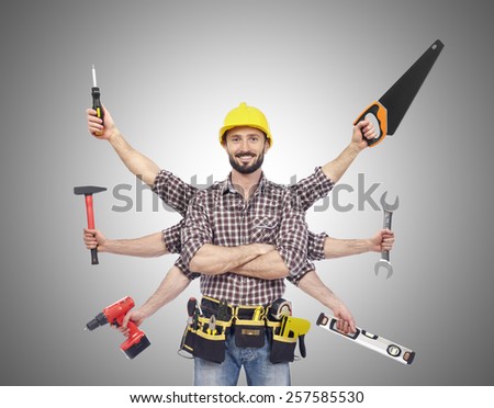 Handyman with tools Royalty-Free Stock Photo #257585530