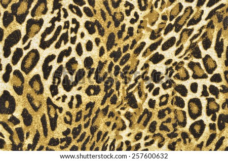 Brown and black leopard pattern. Spotted animal print as background.