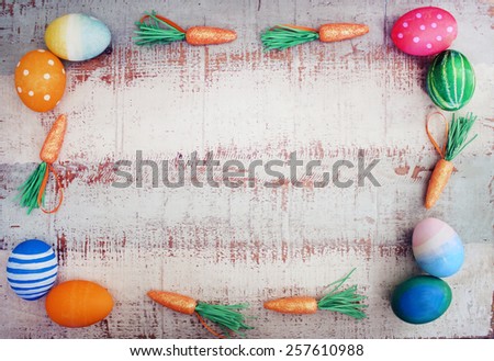 Frame made with easter eggs and carrots.
