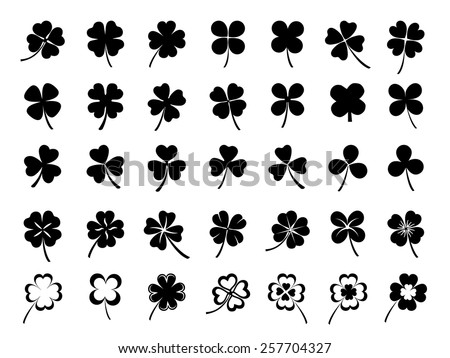Set of three & four leaf clovers Royalty-Free Stock Photo #257704327