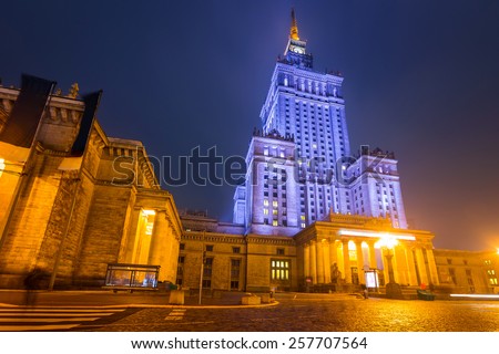 Palace of Culture and Science at night in Warsaw city center, Poland Royalty-Free Stock Photo #257707564
