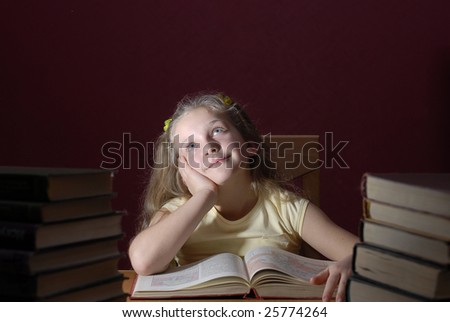 Little girl is reading books