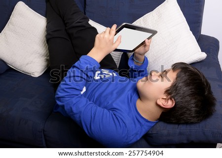 Child uses an Pad to communicate and play.