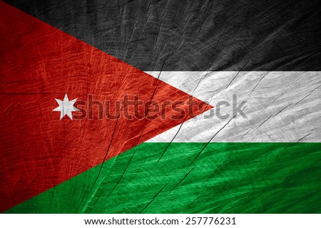 Jordan flag or Jordanian banner on wooden texture