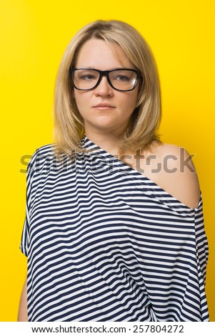 woman in glasses, yellow background