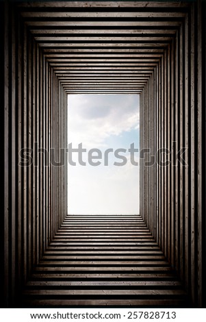 Wood stripped tunnel with sky view on the end, vertical.