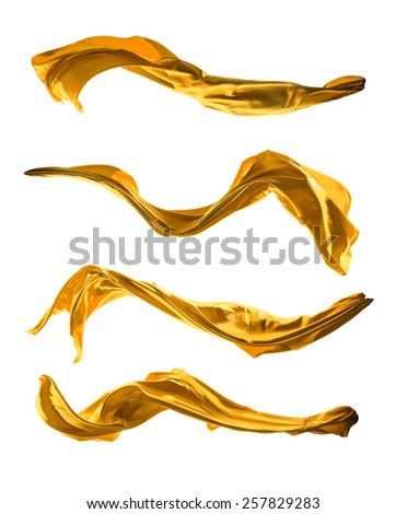 Isolated shot of freeze motion of golden silk, isolated on white background