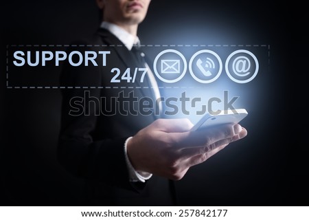 businessman holding a mobile phone with applications icons on the screen.  internet concept. business concept.
