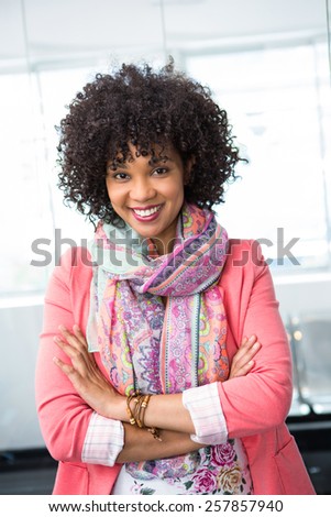 Portrait of confident female fashion designer with arms crossed