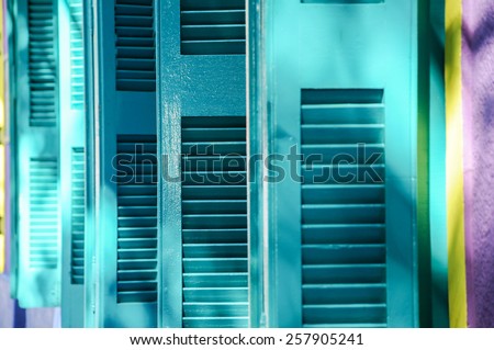 Colorful window shutters of a house in the neighborhood of La Boca, Buenos Aires, Argentina Royalty-Free Stock Photo #257905241