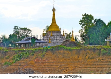 A stupa of a temple on the riverbanks of the Irrawaddy River near Sagaing, a remote northern town of Myanmar. Royalty-Free Stock Photo #257920946