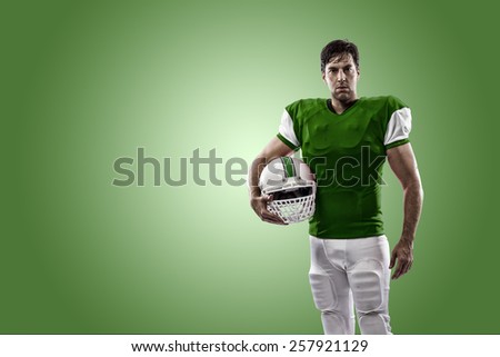 Football Player with a green uniform on a green background.