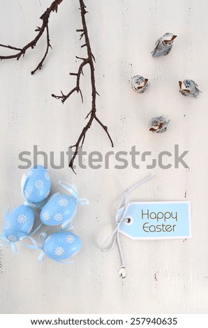 Happy Easter blue and white theme eggs on white wood table background. 