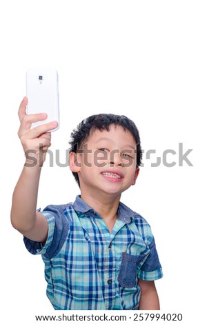 Little Asian boy taking photograph himself by smart phone