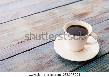Coffee cup on wooden tables - vintage effect style pictures