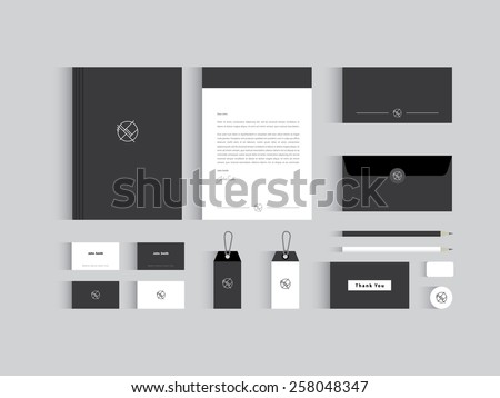 Vector corporate identity mock up. Black and white colors wit abstract symbol. Royalty-Free Stock Photo #258048347