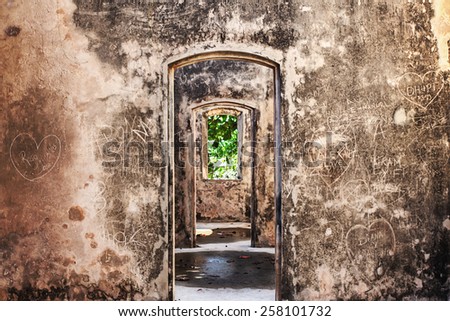 door arch old place window old age inscription legend lettering graffiti graffito Royalty-Free Stock Photo #258101732