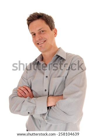 A portrait picture of a handsome young man with his hands crossed looking into the camera, isolated on white background. 