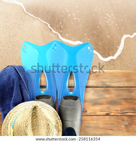 fins hat and sand 