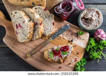 traditional liver pate on fresh bread with cranberry