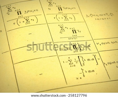 Advanced mathematics (maths) in vintage style. Focus on part of the image only - rest is blur by intention 