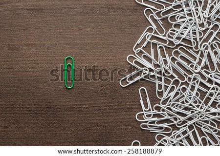 bright green paper clip unique idea concept Royalty-Free Stock Photo #258188879
