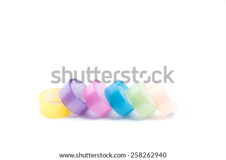 Roll of colorful cellophane tape. Isolated on white background.
