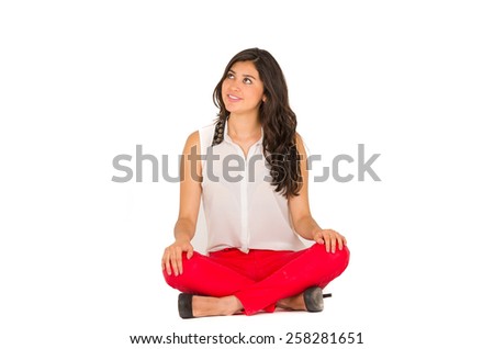 beautiful stylish young brunette girl sitting over white background copy space