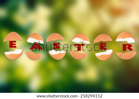Happy Easter decoration egg on green forest background.