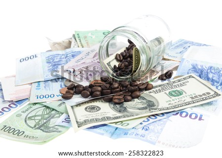 Coffee bean with Several bank notes of american singapore indonesian thai korean and coins isolate on white background