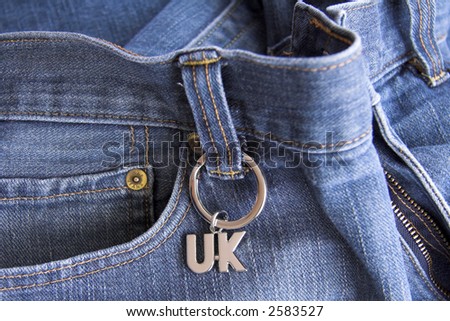 Faded jeans with a UK key ring on belt loop