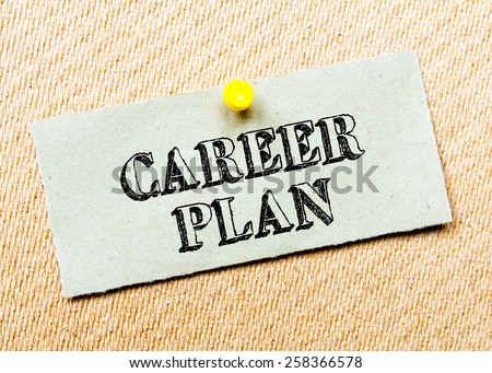 Recycled paper note pinned on cork board.Career Plan Message. Concept Image