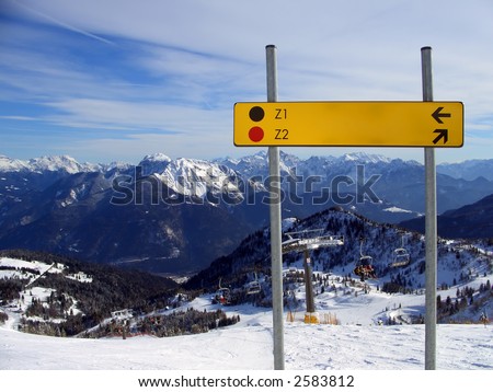 Red and black piste sign on mountaintop, Friuli, Italy Royalty-Free Stock Photo #2583812