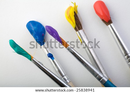 Stock photo: an image of brushes with paint on them