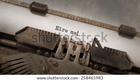 Vintage typewriter, old rusty and used, hire me Royalty-Free Stock Photo #258465983
