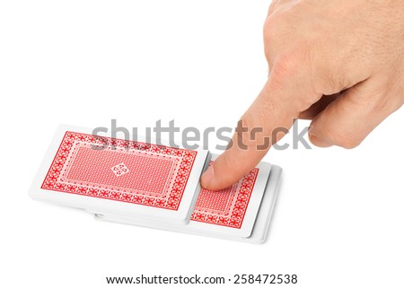 Hand and playing cards isolated on white background
