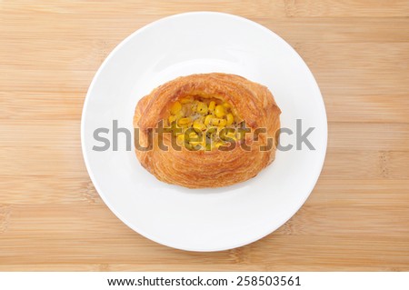 corn danish bread on plate on table