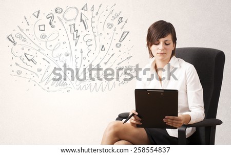 Young girl drawing and skteching abstract lines and symbols 
