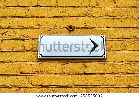 White plate on the yellow wall