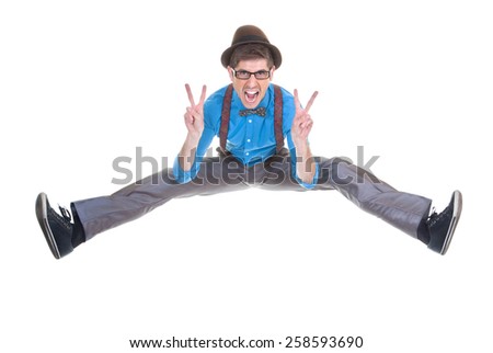 goofy, nerd geek jumping and shouting with v sign