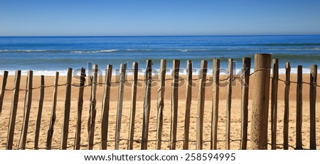 Fence on the beach-Hossegor Royalty-Free Stock Photo #258594995