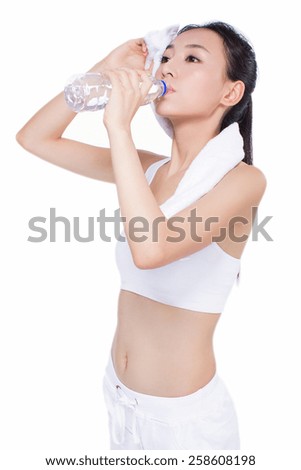 beautiful fitness woman with bottle of water and towel. sport. white background.