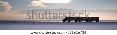 Semi Truck Travels Highway Over Salt Flats Freight Transport