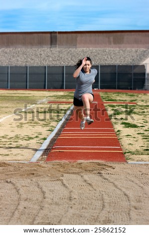 Teen athlete during her triple jump practice Royalty-Free Stock Photo #25862152