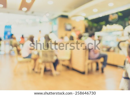 Blurred background : Vintage filter Customer in Coffee shop blur background with bokeh.