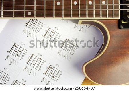 Guitar and guitar chords Royalty-Free Stock Photo #258654737