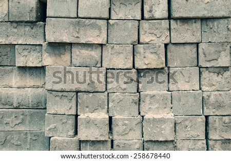Grey bricks stacked in rows