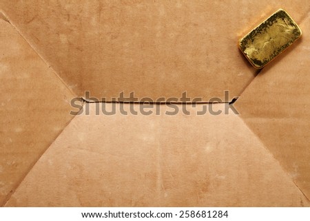 Gold bar put on the old paper box as a background represent the business and investment concept idea related.