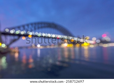 sydney harbour bridge in early morning taken as blury bokeh background