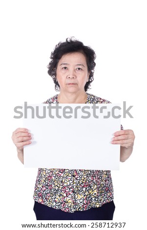 Asian senior female standing with empty horizontal blank paper in hands isolated on white background.